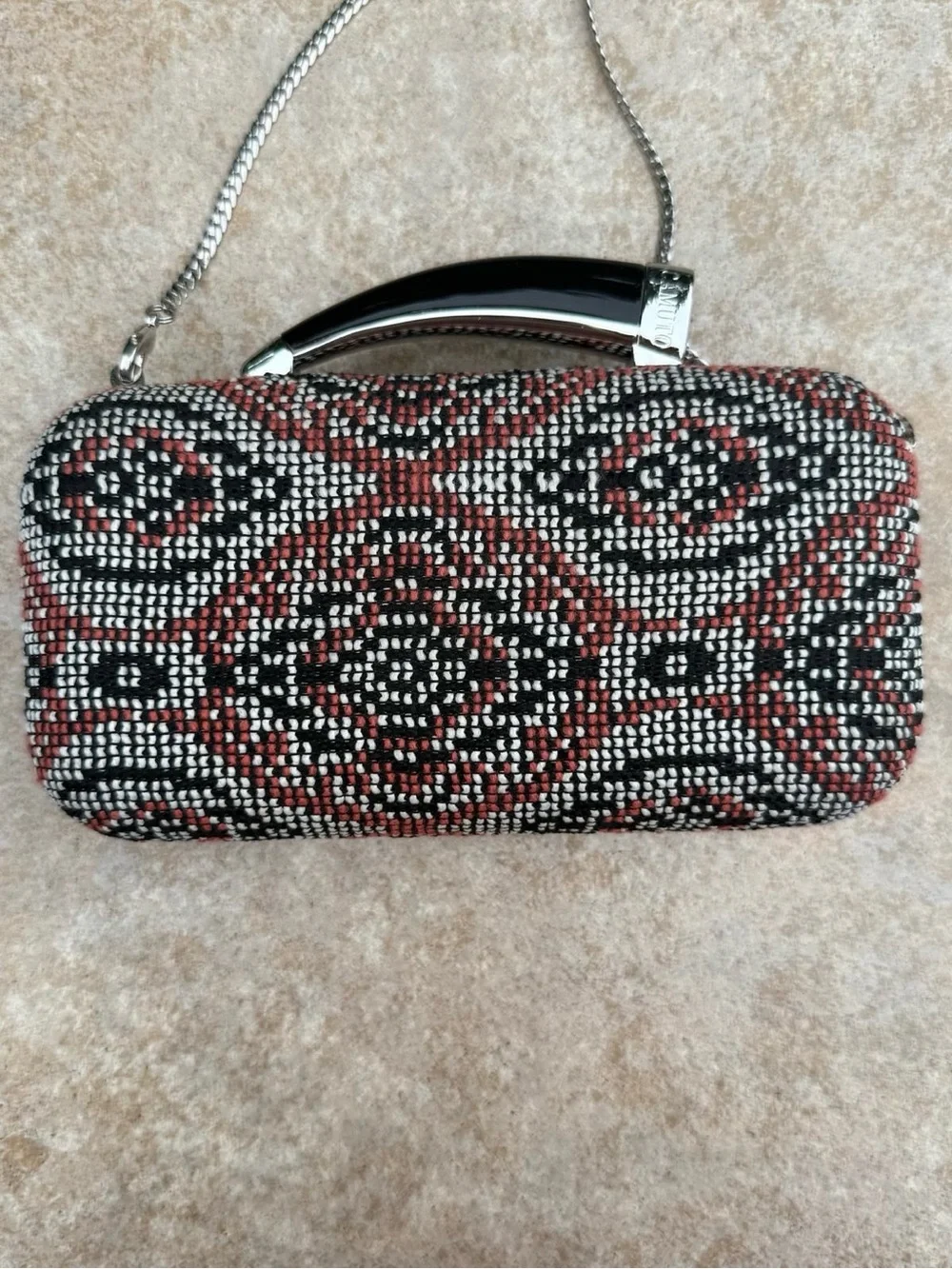 Vince Camuto textured clutch bag with a crossbody chain